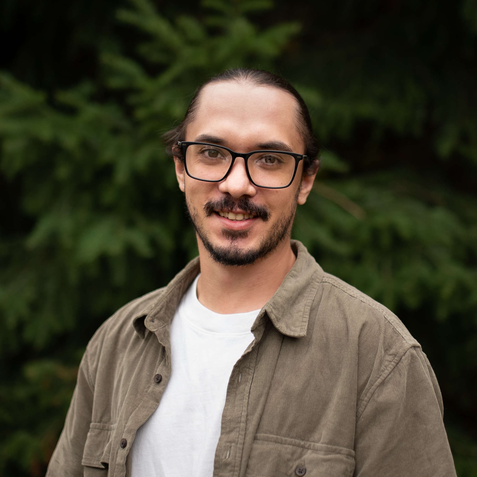 headshot of Haili infront of a tree